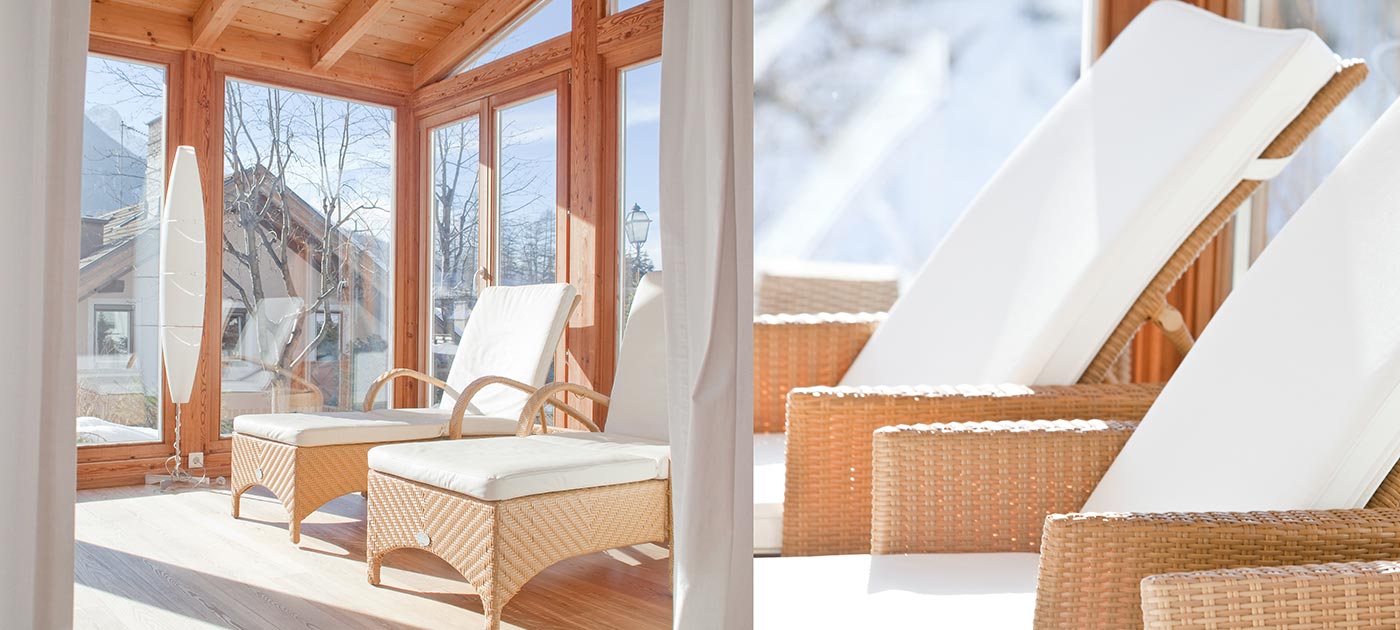 Comfortable wicker beds with white cotton cushions illuminated by sunlight entering the windows of our wellness area